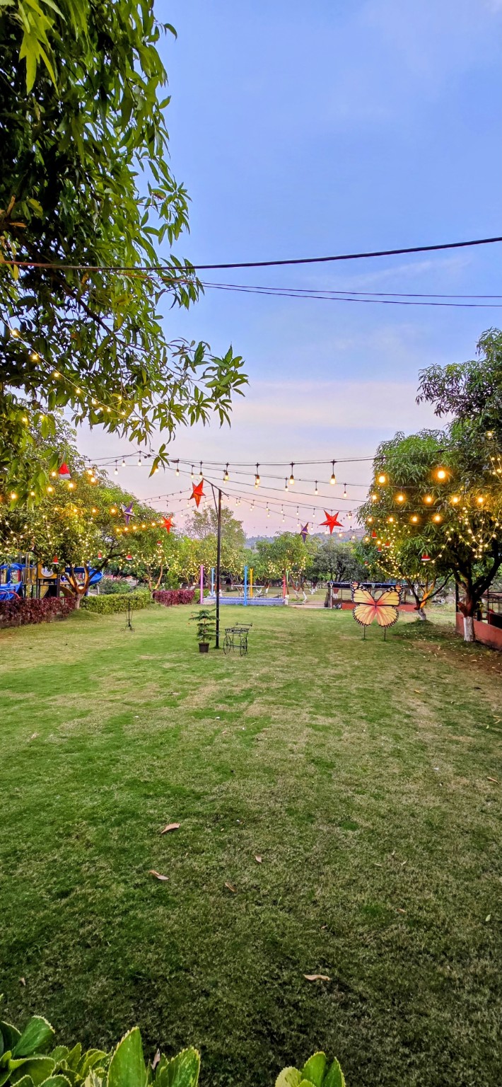Raj Farm Stay Resort evening garden